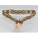 A 9 carat gold gate bracelet, approx 18.9g.