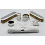 A silver napkin ring, a 3 piece George V silver condiment set and mustard spoon (silver weight