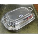 A Geo V silver entrée dish, marked EV for E. Viner, Sheffield, two parts, approx 39.70oz.