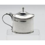 A Victorian silver mustard with blue glass liner, maker TB JH (Thomas Bradbury & Sons) London,