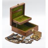 A leather cased jewellery box containing a vintage silver cased ladies wristwatch with 'red 12'