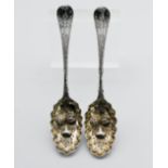 A pair of Georgian silver and gilt fruit spoons, approx 4.70 ounces.