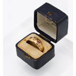 An 18ct yellow gold ruby and diamond Gypsy style ring, size M.