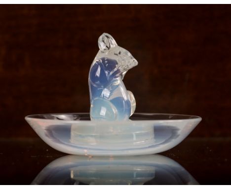 A Rene Lalique opalescent glass 'Souris Cendrier' ashtray, circa 1925, model number 286, depicting a Mouse in upright pose on