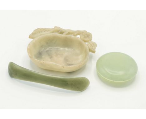 A Chinese carved jade brush washer, of gourd form with floral and foliate branch to side, 4in. (10.2cm.); together with a jad