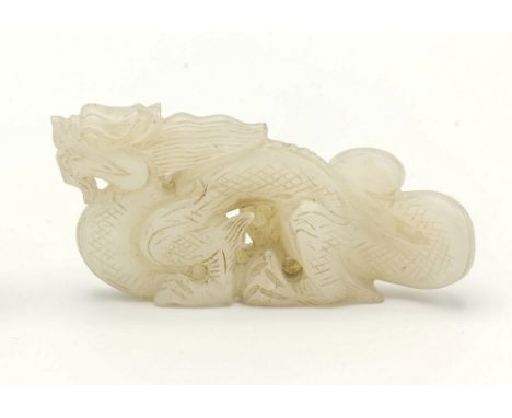 A Chinese white jade dragon pendant, possibly Ming / early Qing period, one side with small patches of pale russet inclusion 