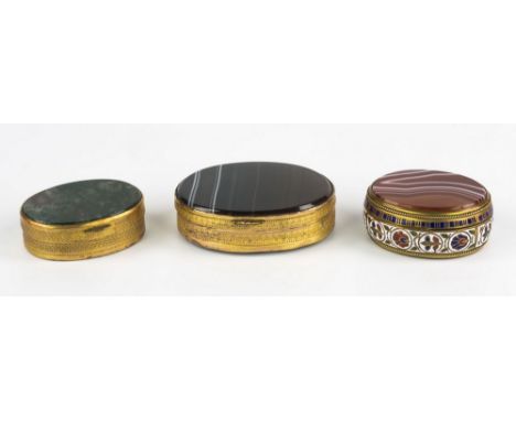 Three 19th century stone set patch boxes, all of oval form, to include a gilt metal example, the hinged lid and base inset wi