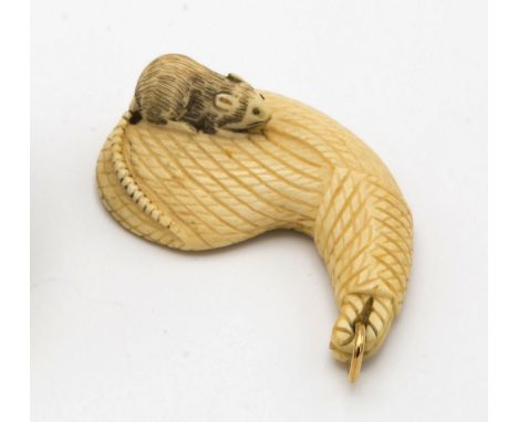 A Japanese carved ivory netsuke, Meiji period (1868-1912), of a rat on a teardrop form bale of rope, signed with two characte