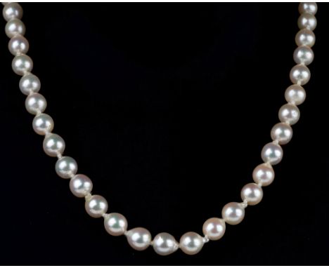 A single strand baroque cultured pearl necklace, with pierced 9ct gold clasp, 17½in. (44.5cm.) long; together with a single s