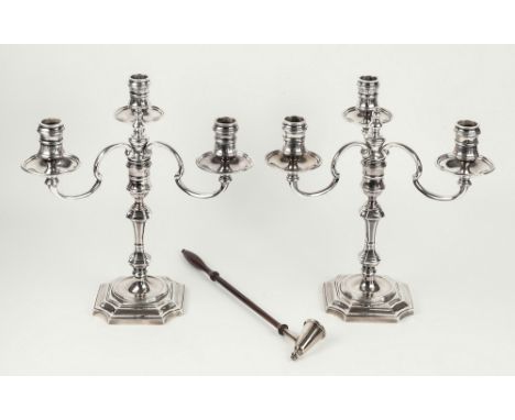 A pair of Elizabeth II silver three light table candelabrum, J. B. Chatterley & Sons Ltd., Birmingham 1976, of George I form,