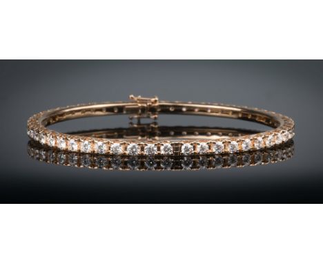 An 18ct rose gold and diamond bangle, the open work bangle set with fifty-two brilliant cut diamonds, total weight 5.66cts, i