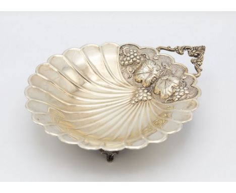 A Scandinavian silver shell shaped dish, mid-20th century, marked '830', scallop form with repoussé fruiting vine decoration 