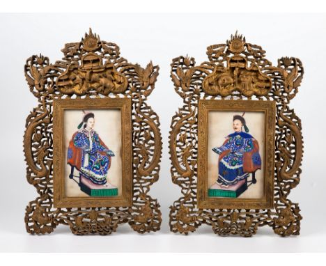 A pair of finely carved wooden Chinese frames, 19th century, carved with auspicious emblems - the upper area having flaming p