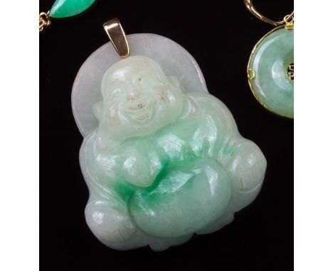 A Chinese carved mottled apple green and celadon jade Buddha pendant, 20th century, with yellow gold bale, 2 x 1¾in. (5 x 4.5