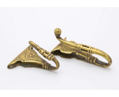 Two 17th / 18th century Persian brass belt hooks, one with shaped triangular backplate with engraving to upturned hook, 2¾in.