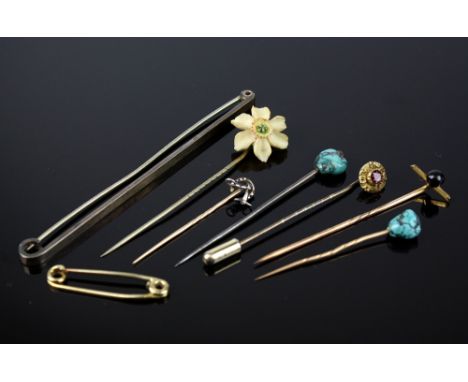 Six antique and vintage stick pins, three rose gold, one silver and two gilt metal; together with two brooch pins. (8)