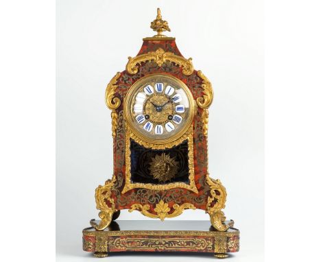 A 19th century French tortoiseshell boullework mantel clock and stand, in the Louis XVI taste, the red tortoiseshell veneered