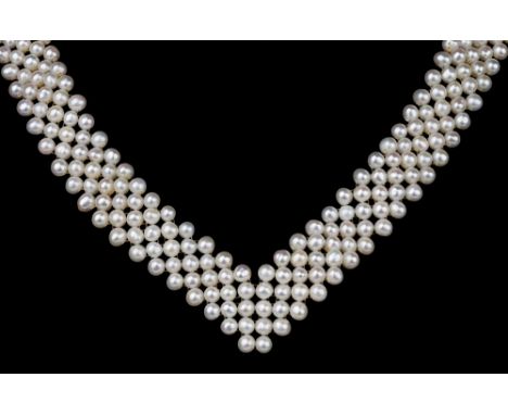 A five row cultured pearl necklet and bracelet, 1950s-60s, the pearls approx. 3mm. diameter, with brass clasps, the necklet a