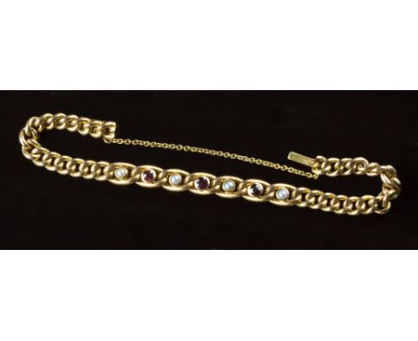 A Victorian 15ct yellow gold, ruby and natural seed pearl bracelet, the curb link chain set with three round cut rubies and f