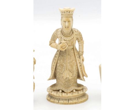 A finely carved Chinese Canton export ivory chess piece, 19th century, the Queen depicted in a foliate decorated robe and con