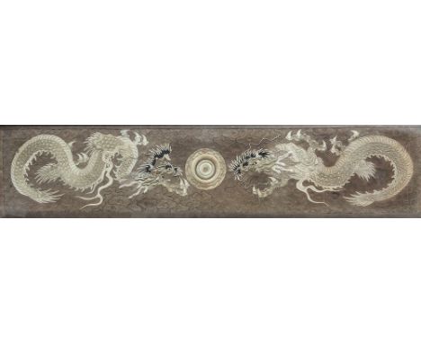 A large 19th century Chinese silk dragon panel, worked in shades of gold and black with gold thread details, depicting two dr