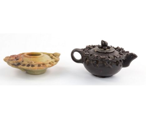 A Chinese ebonised miniature soapstone teapot, 19th century, circular with floral pendant engraved decoration and carved pier