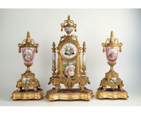 A French gilt metal three piece mantel clock garniture with Sevres style mounts, late 19th / early 20th century, with eight d