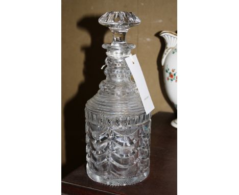 A late Georgian cut glass straight sided decanter, the triple facetted ring and panel cut neck over a step cut shoulder and s