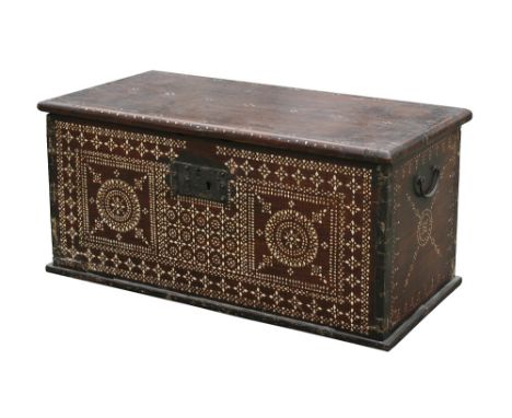 A small antique Indian hardwood dowry chest, inlaid with mother-of-pearl, interior with candlebox, wrought iron swing handles