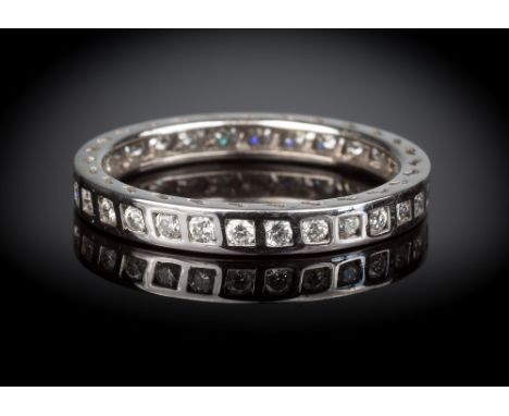An 18ct white gold and diamond full eternity ring, inset with thirty brilliant cut diamonds, total weight 0.55 cts, with wave