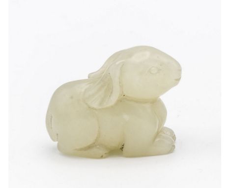 A Chinese white jade rabbit, possibly Ming / early Qing period, well carved and depicted in recumbent pose, 1 3/8in. (3.5cm.)