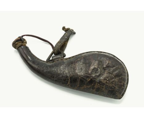 A Barut Dan Indo-Persian leather powder flask, circa 1800, curved neck to bulbous lower area, open triangular mount to front 