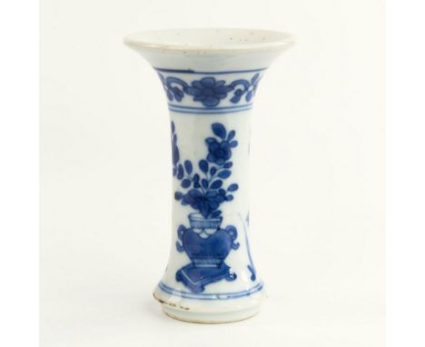 A small Chinese 18th century blue and white porcelain gu form vase, flared neck with floral and scroll border above cylindric