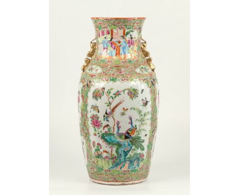 An early 19th century Chinese Canton famille rose vase, ovoid form with moulded linen fold decoration and gilt twin-Buddhisti