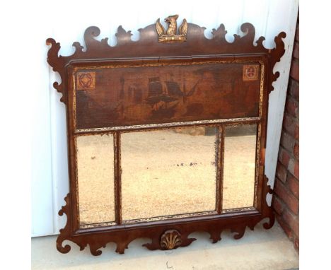 A Georgian style fretwork triple plate mirror, 19th century, the pediment with gilt armorial crest above a painting depicting