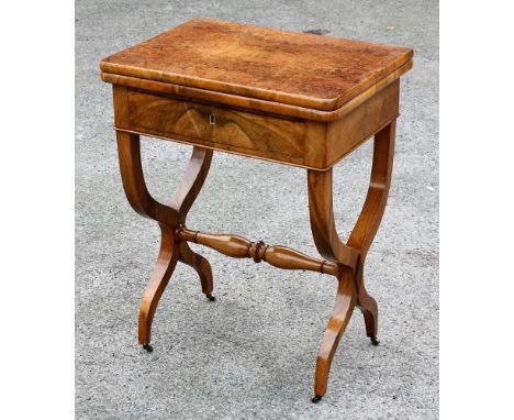 A 19th century Continental burr and figured walnut card table, the rounded rectangular fold over top quarter veneered in burr