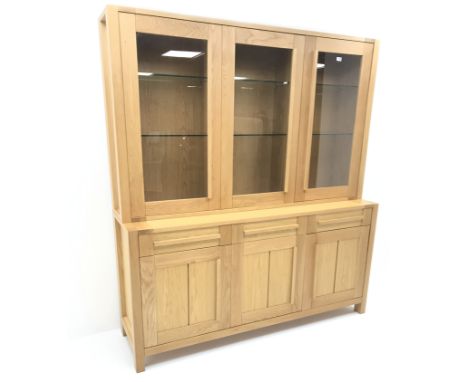 Marks & Spencer's Home light oak display dresser, three doors enclosing six adjustable glazed shelves above three drawers and