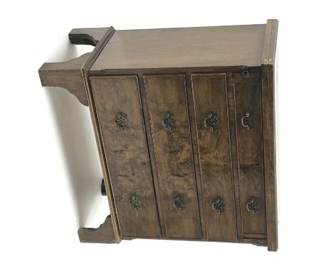 George I style cross banded figured walnut bachelor's chest, hinged lid above four graduating drawers, shaped bracket support