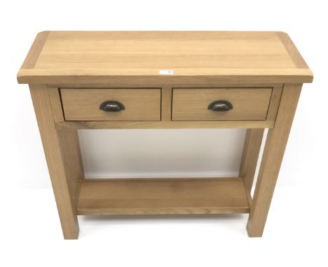 Light oak side table, two drawers, square supports joined by an undertier, W86cm, H75cm, D32cm Condition Report Click here fo