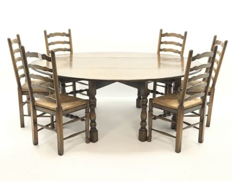 Medium oak oval drop leaf wake dining table on turned gate leg base (L198cm x W156cm, max measurements) and set six ladder ba