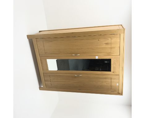 Light oak triple wardrobe, two doors flanking central mirror, stile supports, W133cm, H186cm, D56cm Condition Report Click he