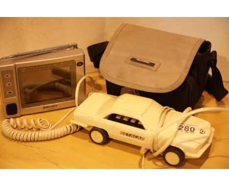 Betacom novelty telephone and a cased portable Roadstar colour TV. P&amp;P Group 2 (£18+VAT for the first lot and £2+VAT for 