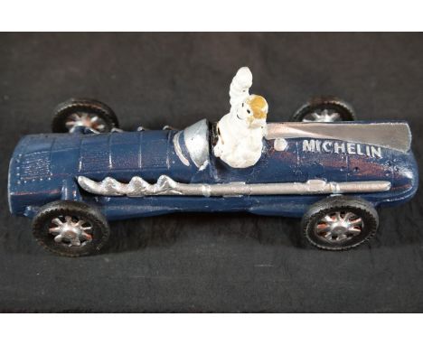 Cast iron Michelin man racing car in blue, L: 27 cm. P&amp;P Group 2 (£18+VAT for the first lot and £2+VAT for subsequent lot
