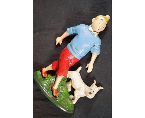 Cast iron Tin Tin and dog doorstop, H: 30 cm. P&amp;P Group 2 (£18+VAT for the first lot and £2+VAT for subsequent lots) 