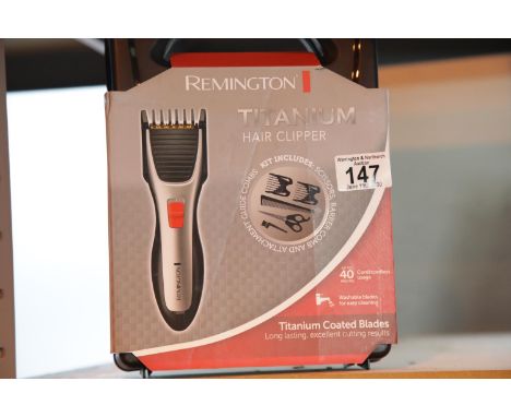 Cased Remington titanium hair clipper. P&amp;P Group 1 (£14+VAT for the first lot and £1+VAT for subsequent lots) 