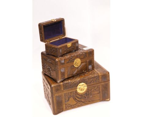 Set of three hand carved Oriental wood boxes with brass locks. P&amp;P Group 2 (£18+VAT for the first lot and £2+VAT for subs