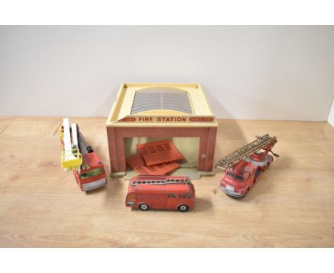 A Dinky Supertoys 954 Fire Station, damage seen as images, doors present along with two Dinky Die-casts, 259 Fire Engine and 