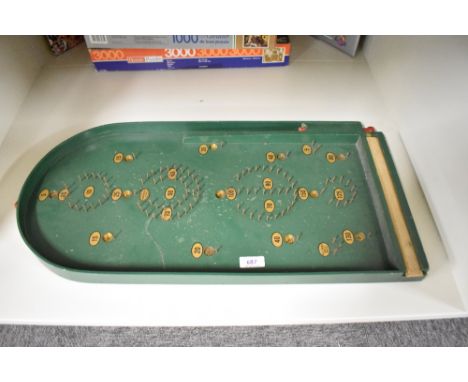 A Chad Valley Bagatelle Board with ball bearing present