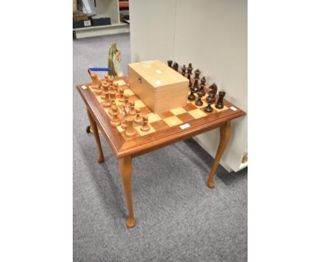 A modern Chess board table with a complete set of modern wooden Chess pieces in wooden box
CONDITION REPORT
Height of King is