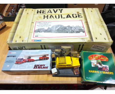 Assorted boxed toys comprising Corgi Heavy Haulage truck CC12305 and Corgi CC11802, together with an Only Fools... alarm cloc